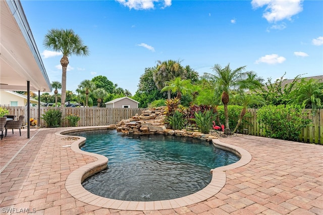 view of pool featuring a patio