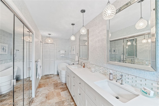 bathroom featuring vanity, a bathing tub, tile walls, and decorative backsplash