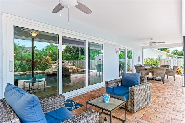 sunroom / solarium with ceiling fan