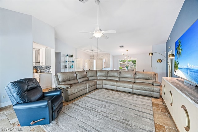 living room featuring vaulted ceiling and ceiling fan