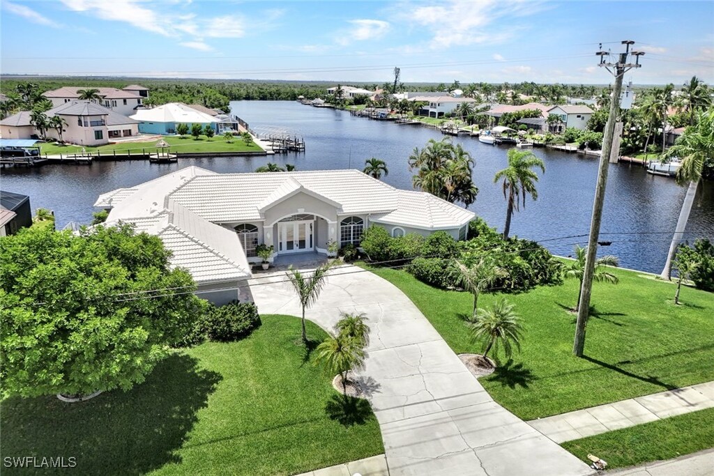 bird's eye view featuring a residential view and a water view