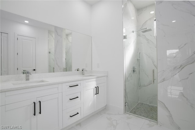 bathroom with a shower with door and vanity