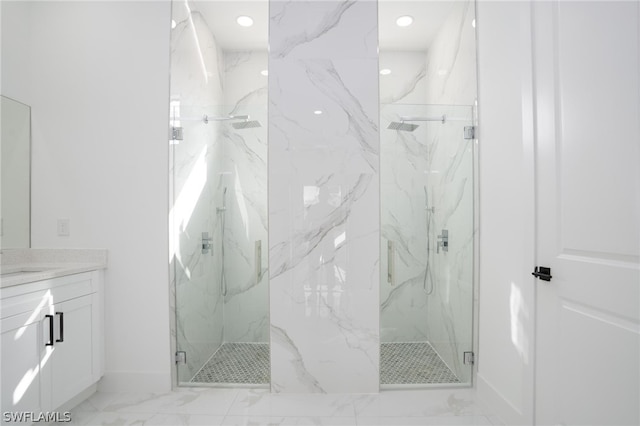 bathroom featuring vanity and a shower with shower door