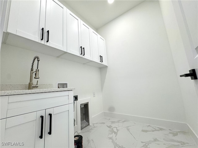 laundry room featuring cabinets, hookup for a washing machine, sink, and electric dryer hookup