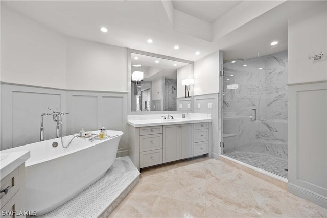 bathroom featuring vanity and plus walk in shower