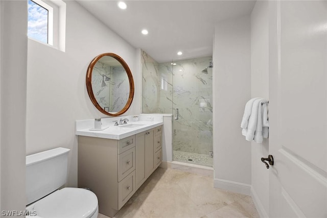 bathroom featuring walk in shower, vanity, and toilet