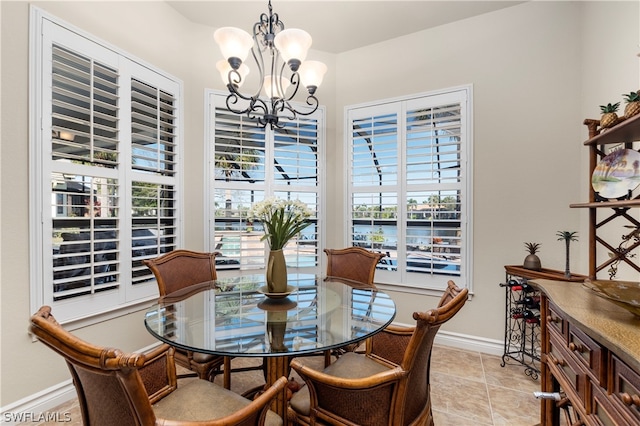 dining space featuring an inviting chandelier and light tile patterned floors