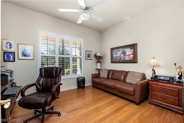 office space with light wood-type flooring and ceiling fan