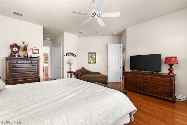 bedroom featuring ceiling fan, hardwood / wood-style floors, and a closet