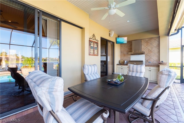 dining room featuring tile patterned flooring and ceiling fan