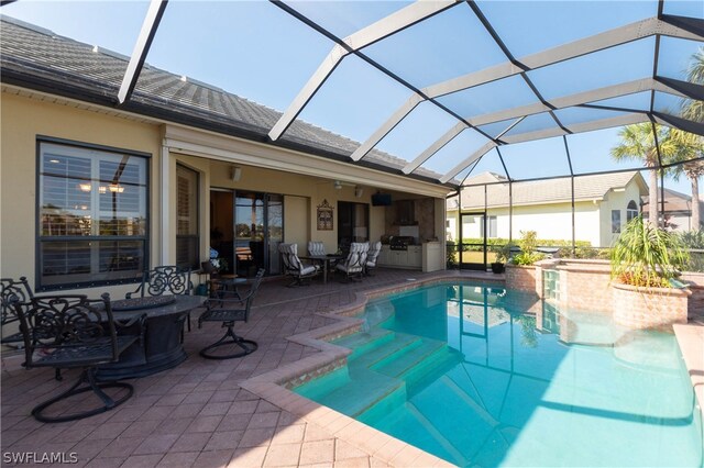 view of swimming pool with a patio area and a lanai