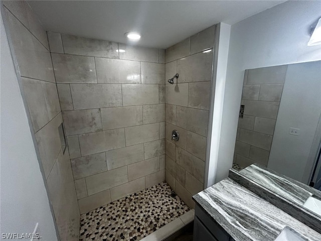 bathroom featuring a tile shower