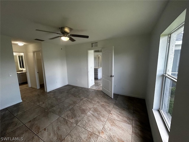 spare room with ceiling fan