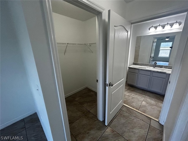 bathroom with tile patterned flooring and vanity