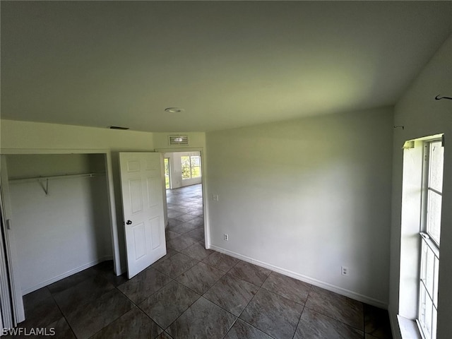 unfurnished bedroom featuring a closet