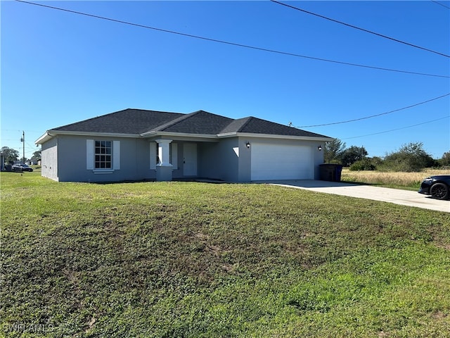 view of front of home featuring a garage and a front lawn