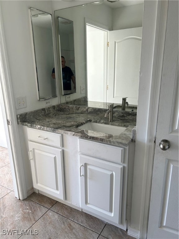 bathroom featuring tile patterned floors and vanity