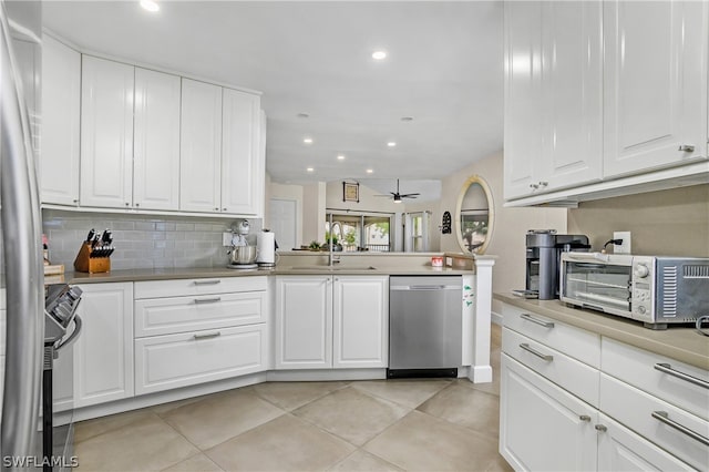 kitchen featuring white cabinetry, sink, stainless steel appliances, and ceiling fan