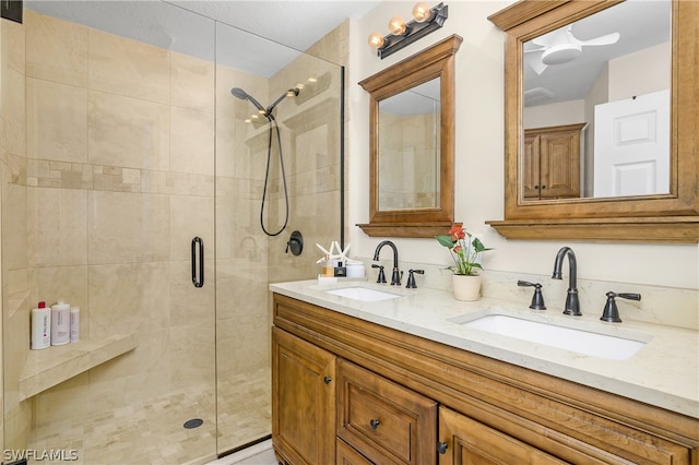 bathroom with vanity and a shower with shower door