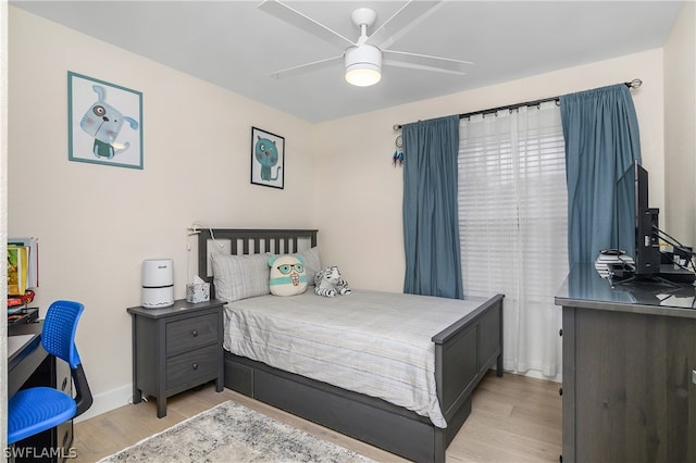 bedroom with ceiling fan and light hardwood / wood-style flooring