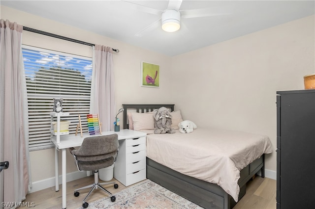 bedroom featuring ceiling fan and light hardwood / wood-style floors