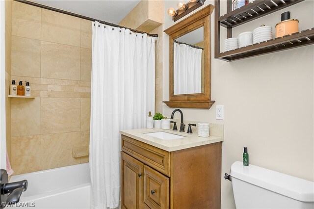 full bathroom with vanity, toilet, and shower / bath combo with shower curtain