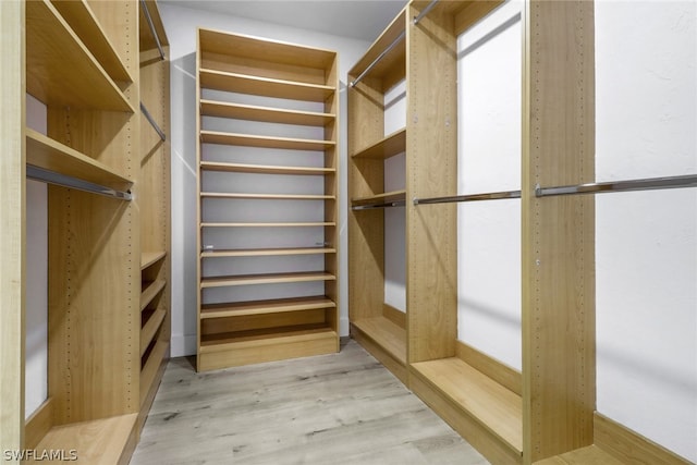 walk in closet featuring light hardwood / wood-style floors