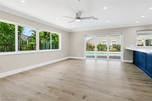 unfurnished living room with ceiling fan, light hardwood / wood-style flooring, and ornamental molding