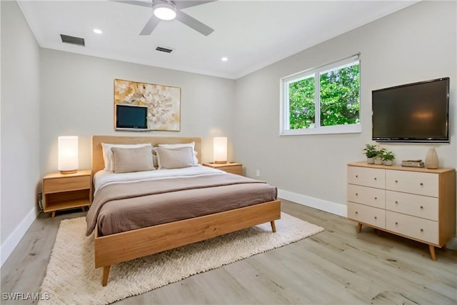 bedroom featuring light wood-type flooring and ceiling fan