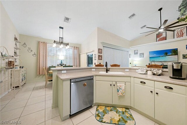 kitchen with light tile patterned floors, dishwasher, ceiling fan, vaulted ceiling, and sink