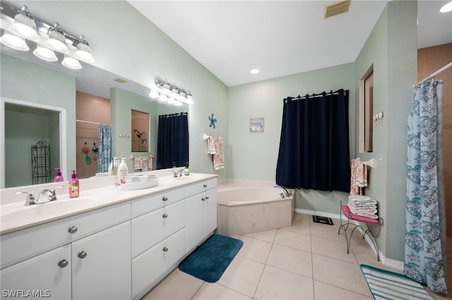 full bath with a garden tub, tile patterned flooring, visible vents, and a sink