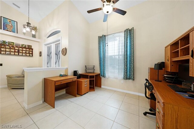 tiled office with ceiling fan with notable chandelier and high vaulted ceiling