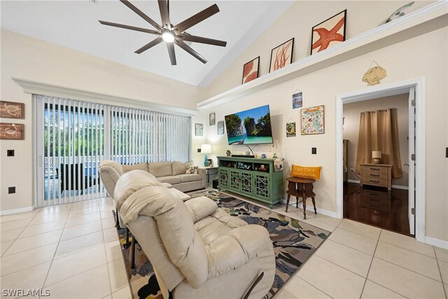 living room with high vaulted ceiling, light tile patterned floors, and ceiling fan