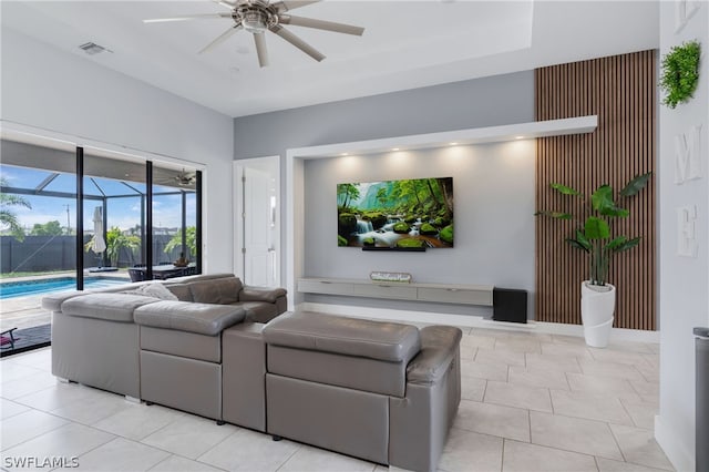 living room with light tile patterned floors and ceiling fan