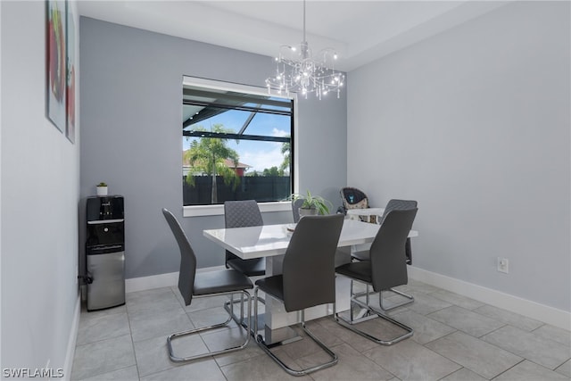 dining space featuring a notable chandelier and light tile patterned floors