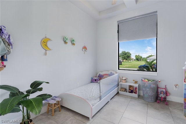 bedroom with light tile patterned floors and ceiling fan