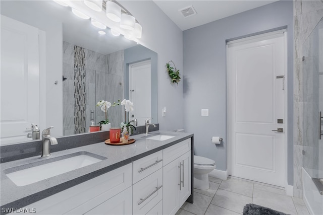 full bathroom featuring dual vanity, toilet, tile patterned floors, and tiled shower / bath combo