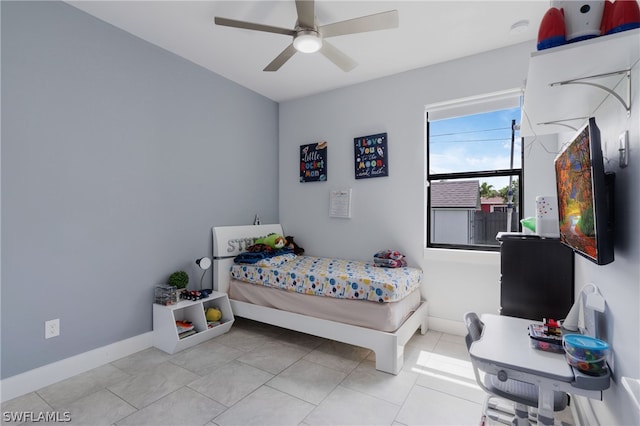 tiled bedroom with ceiling fan