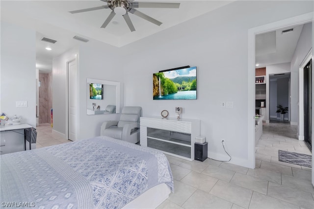 tiled bedroom featuring ceiling fan