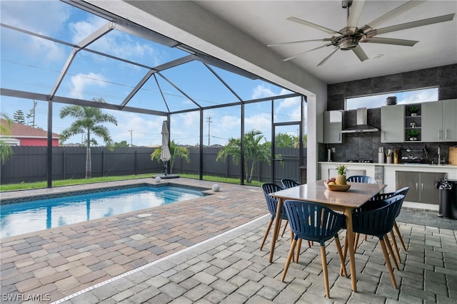 view of pool with a patio, a lanai, and ceiling fan