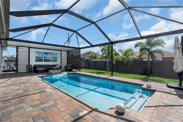 view of swimming pool featuring a lanai and a patio