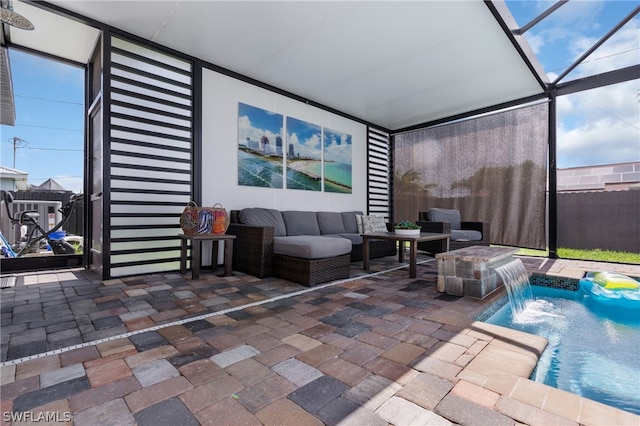 sunroom featuring a hot tub and a wealth of natural light