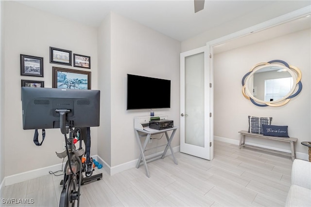 workout area with hardwood / wood-style floors