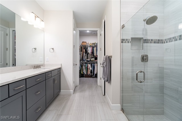 bathroom featuring vanity, tile patterned floors, and an enclosed shower