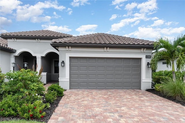 view of front of property featuring a garage