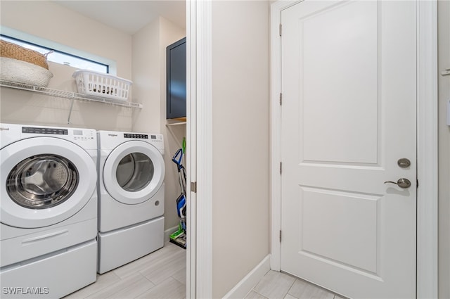 laundry area with independent washer and dryer