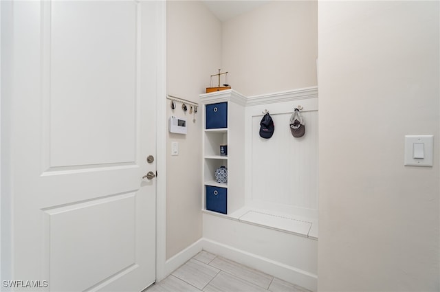 mudroom with light tile patterned flooring