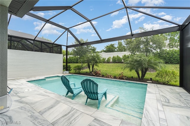 view of swimming pool featuring a patio area and glass enclosure