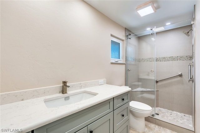 bathroom featuring vanity, an enclosed shower, tile patterned flooring, and toilet