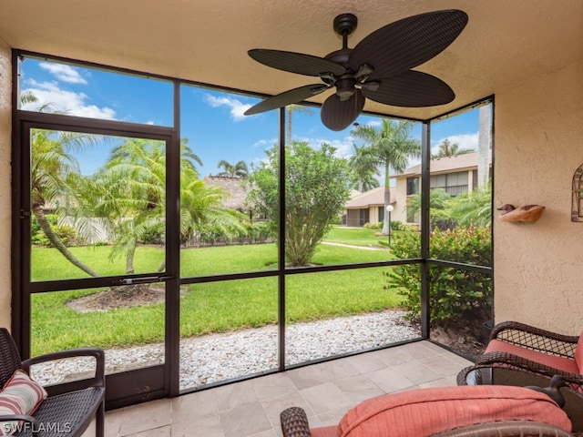 sunroom / solarium with ceiling fan